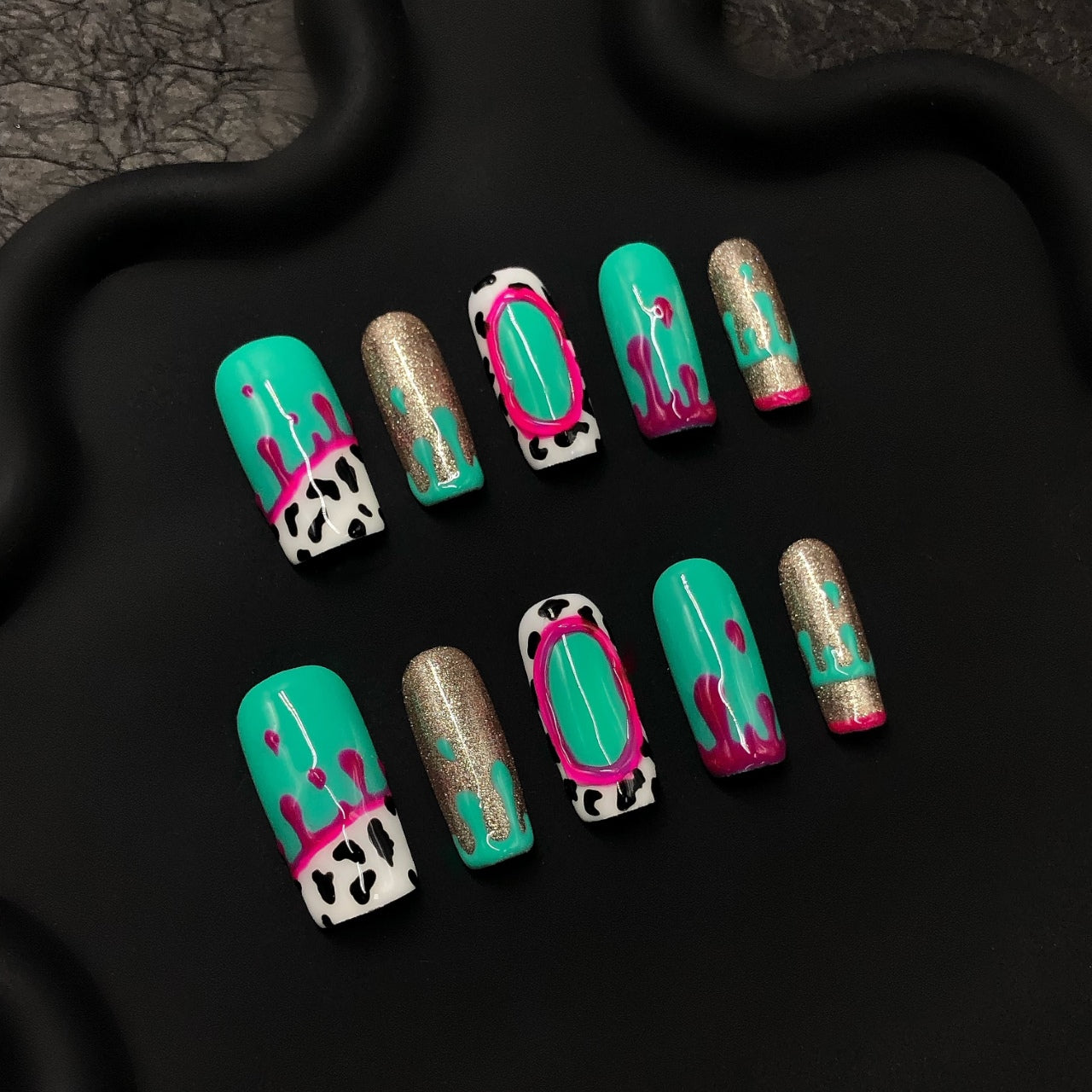 3D Emerald Green & Gold Cow Print Crystal Press-On Nails, designed for women, featuring 100% hand-pressed nails and a reusable UV-cured acrylic set with pink, red, and black-and-white cow print accents.